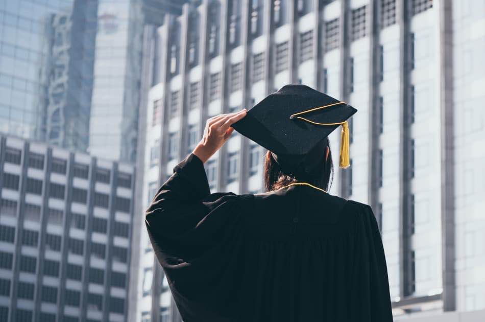 women in graduation cap and gown